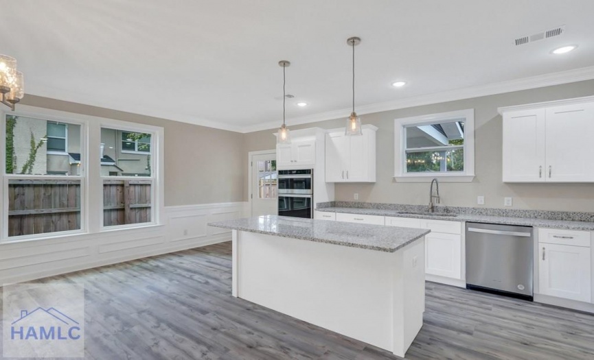 Open Concept Kitchen with an Island & Granite Coun