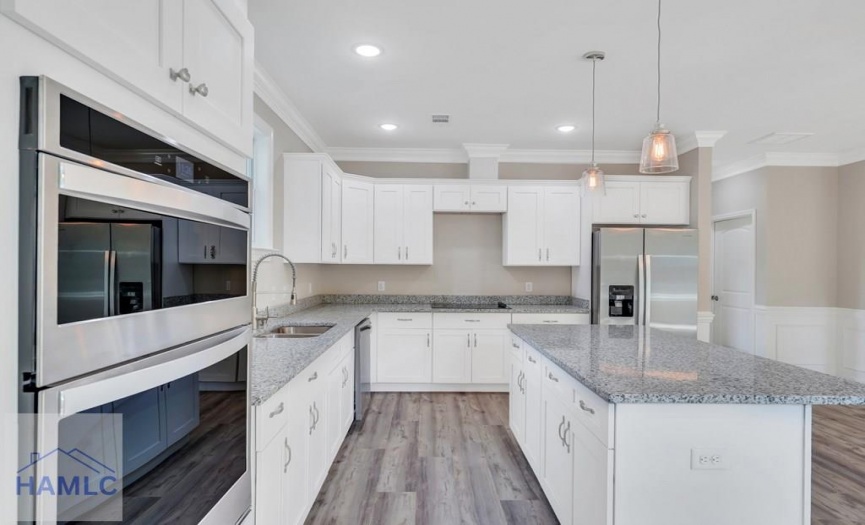 Open Concept Kitchen with an Island & Granite Coun