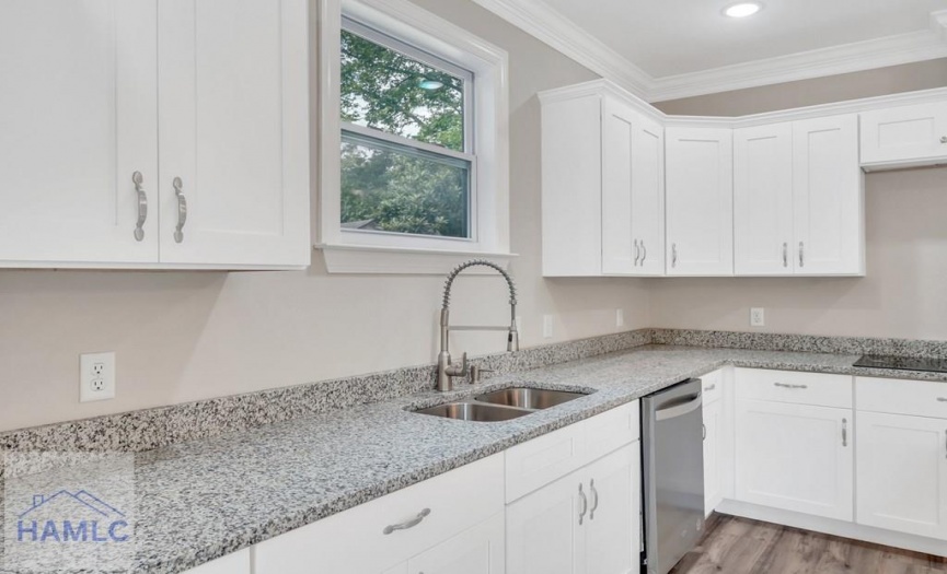 Open Concept Kitchen with an Island & Granite Coun