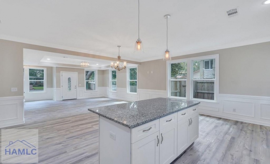 Open Concept Kitchen with an Island & Granite Coun