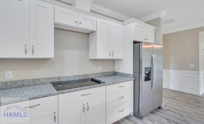 Open Concept Kitchen with an Island & Granite Coun